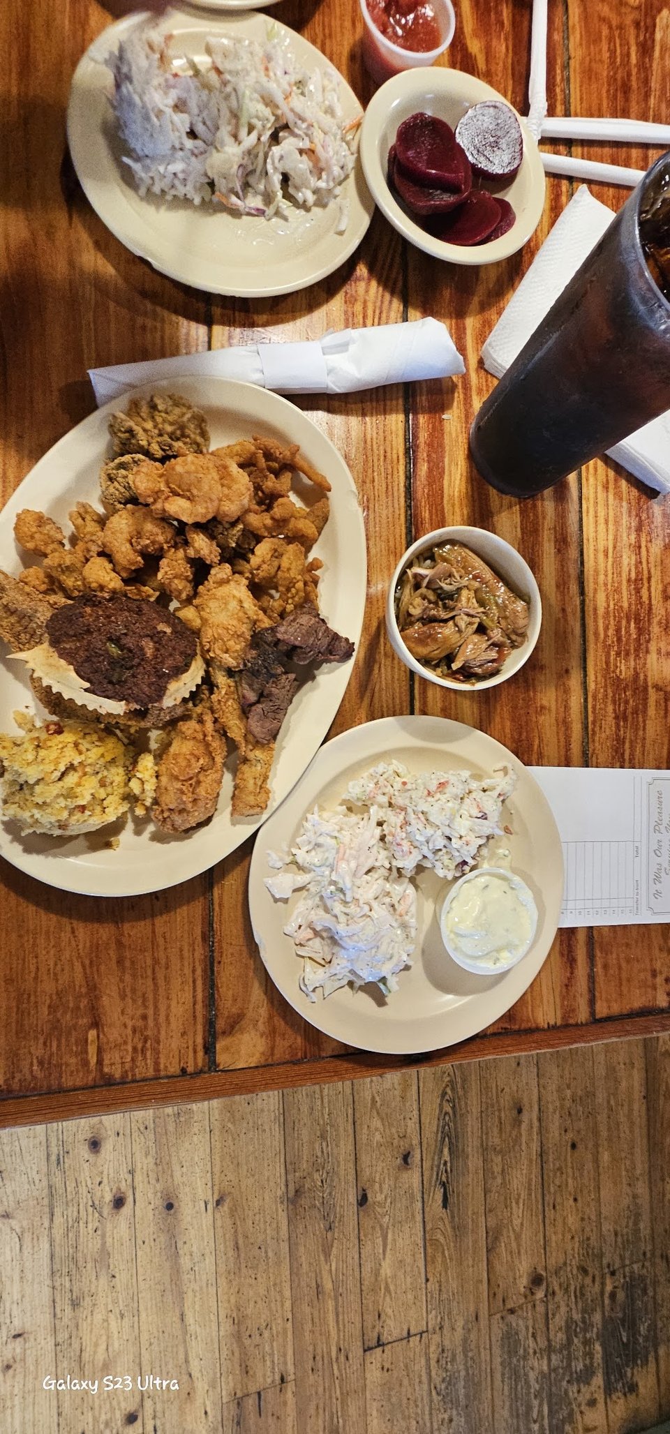 Printed menu with appetizers, salads, and burgers.