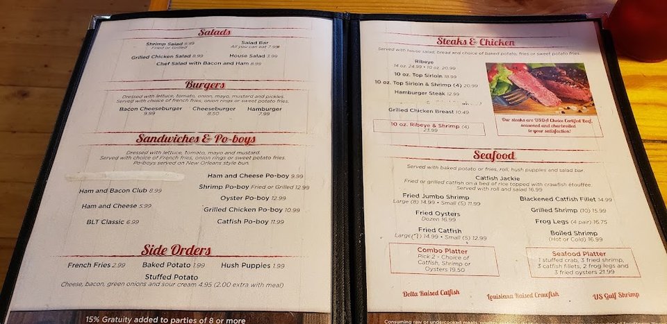 Burger and salad selections on a restaurant menu.